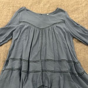 Dusty sky blue blouse, size medium. Peekaboo detail where you see the trim.